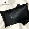 Luxurious black silk satin pillowcases with a glossy, elegant finish