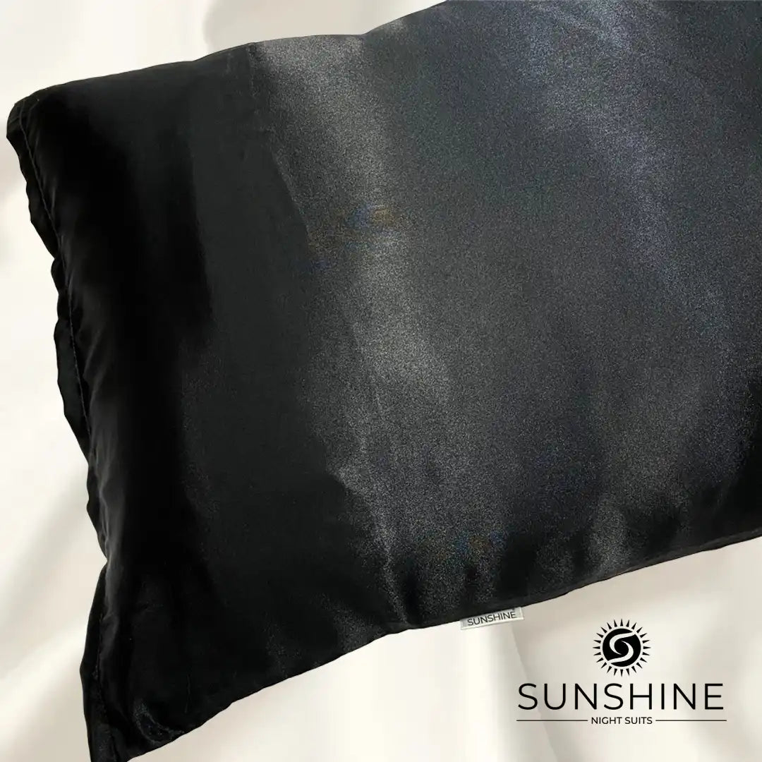 Luxurious black silk satin pillowcases with a glossy, elegant finish