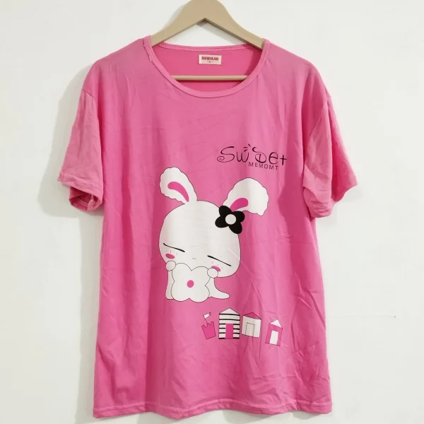 A woman wearing Cute Cat T-shirt Pajama Set, showcasing the iconic Cute Cat design.